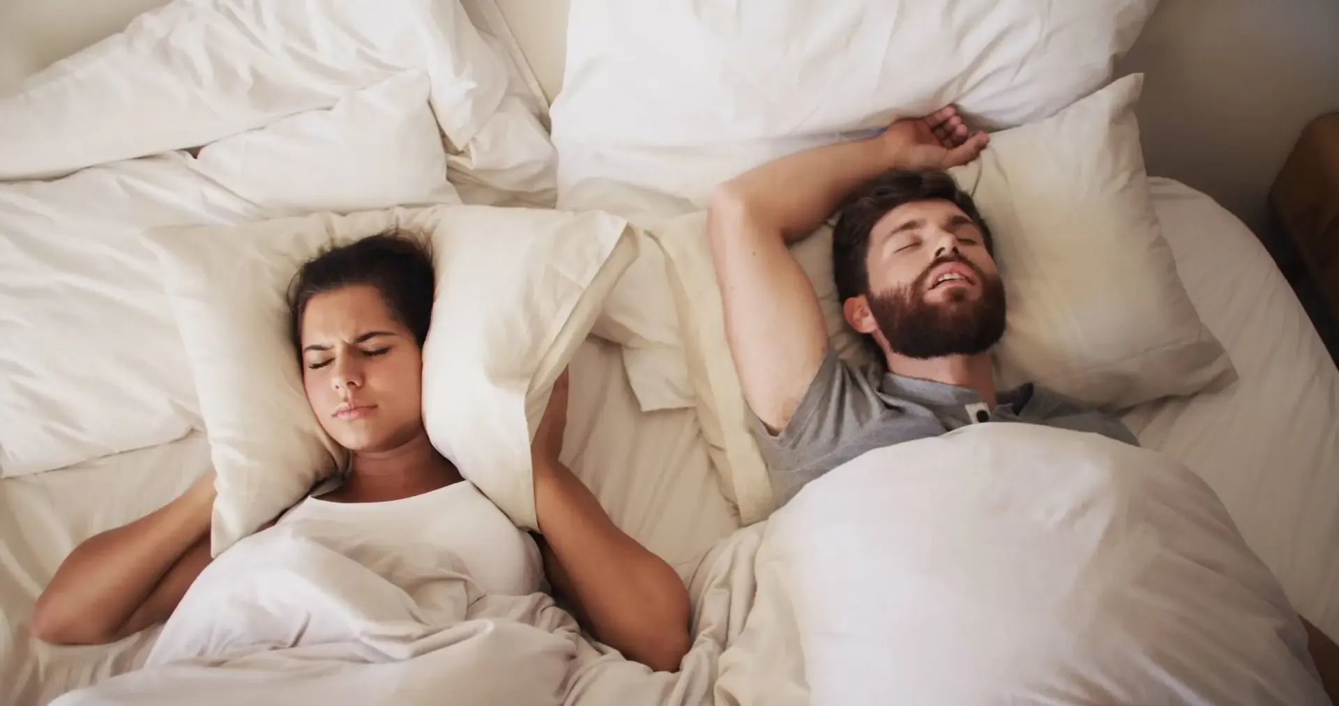 A person asleep; snoring and sleep apnoea